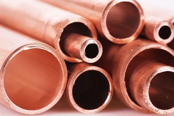 Set Of Copper Pipes Of Different Diameter Lying In One Heap
