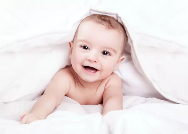 Free Download Happy And Cute Little Baby Smiling Under White Blanket - GFXLoad